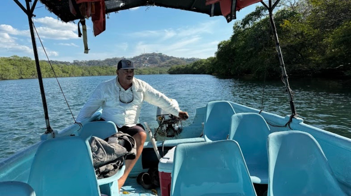 Enrique on his boat in Tamarindo estuary